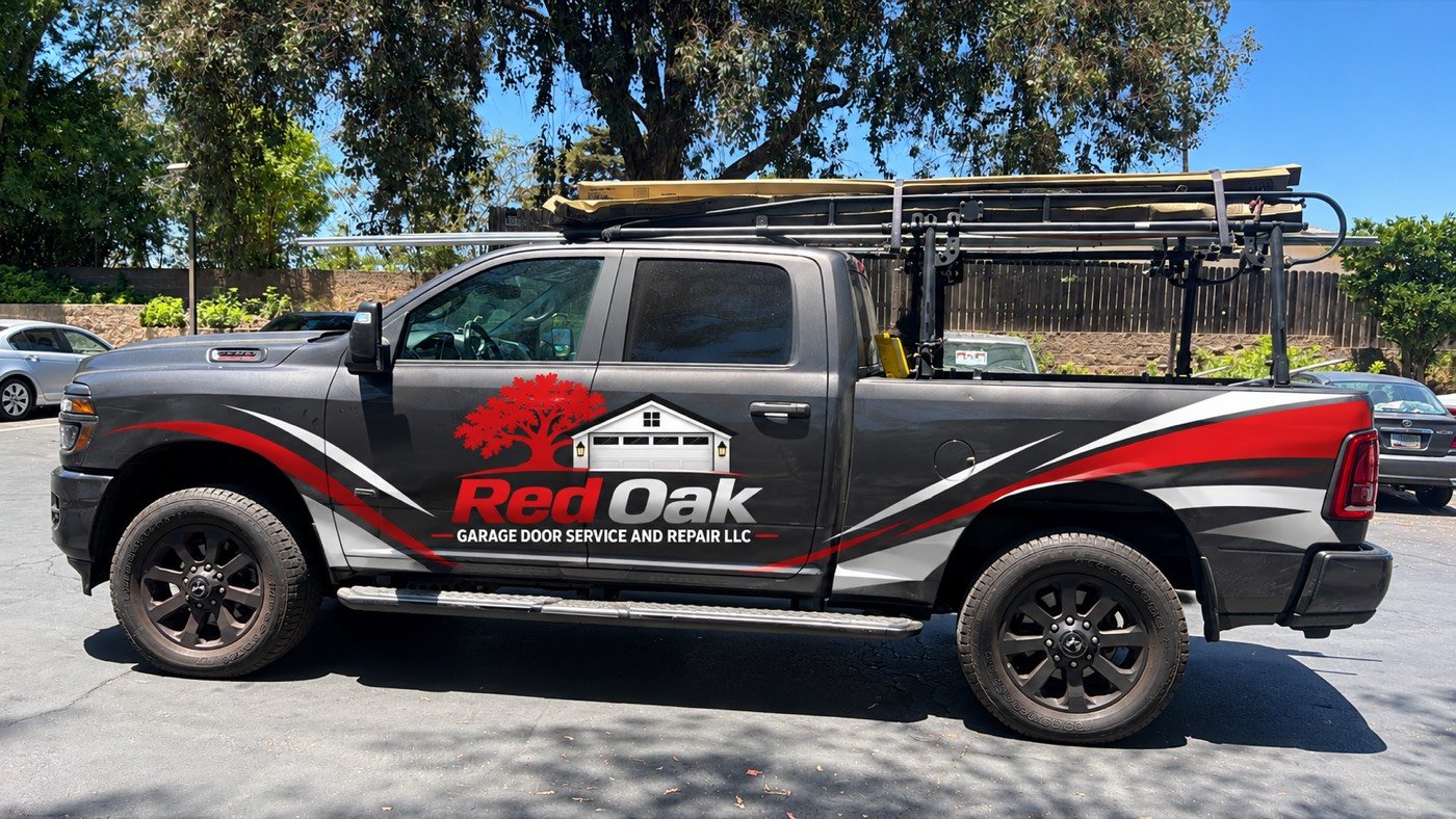 Red Oak Garage Door service truck with ladders on the roof parked in a Cleveland driveway